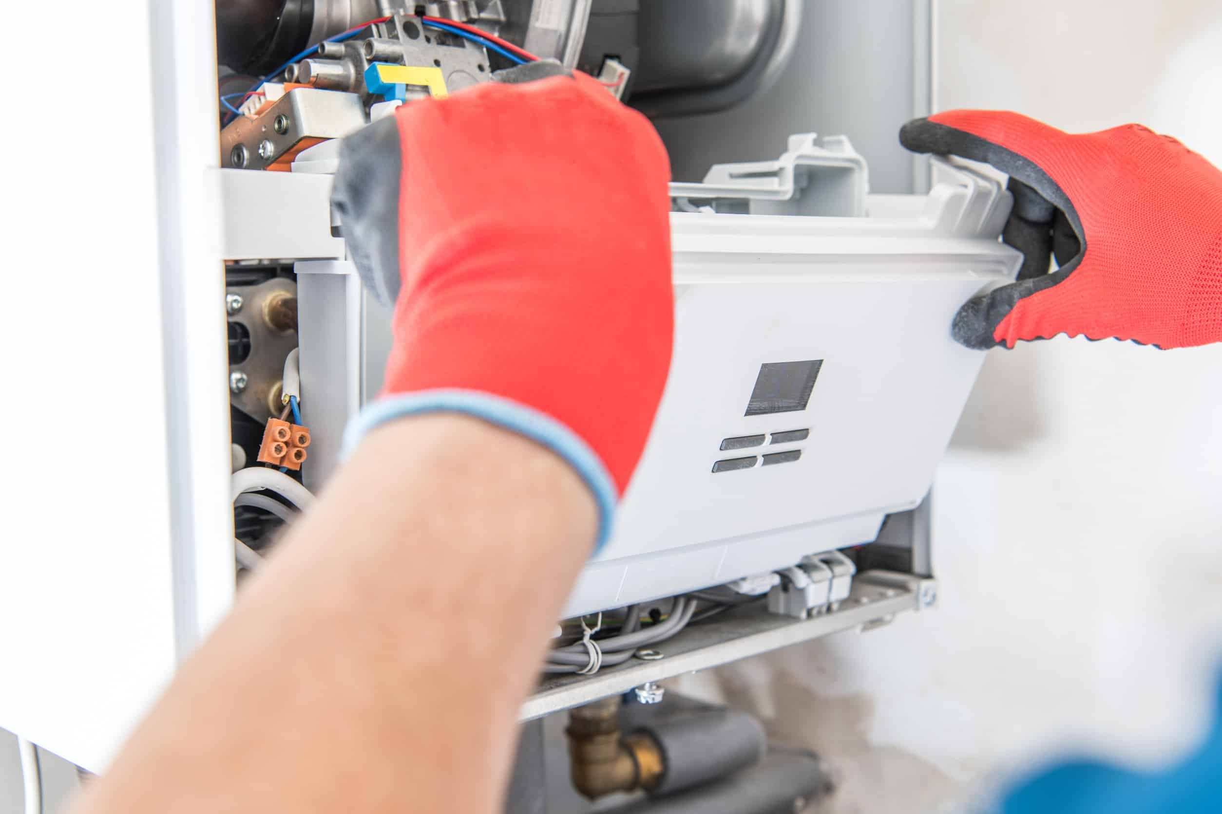 technician providing repairs for heating system